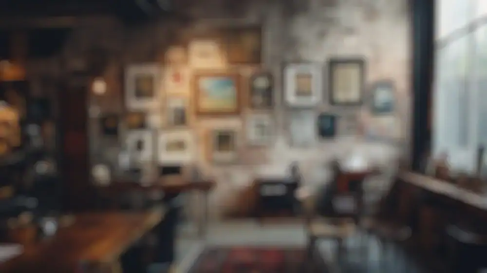 A cozy, softly lit café with vintage wooden tables and chairs, exposed brick walls, and a gallery of framed art and photos arranged on the wall. Sunlight streams in through a large window. The image is out of focus.